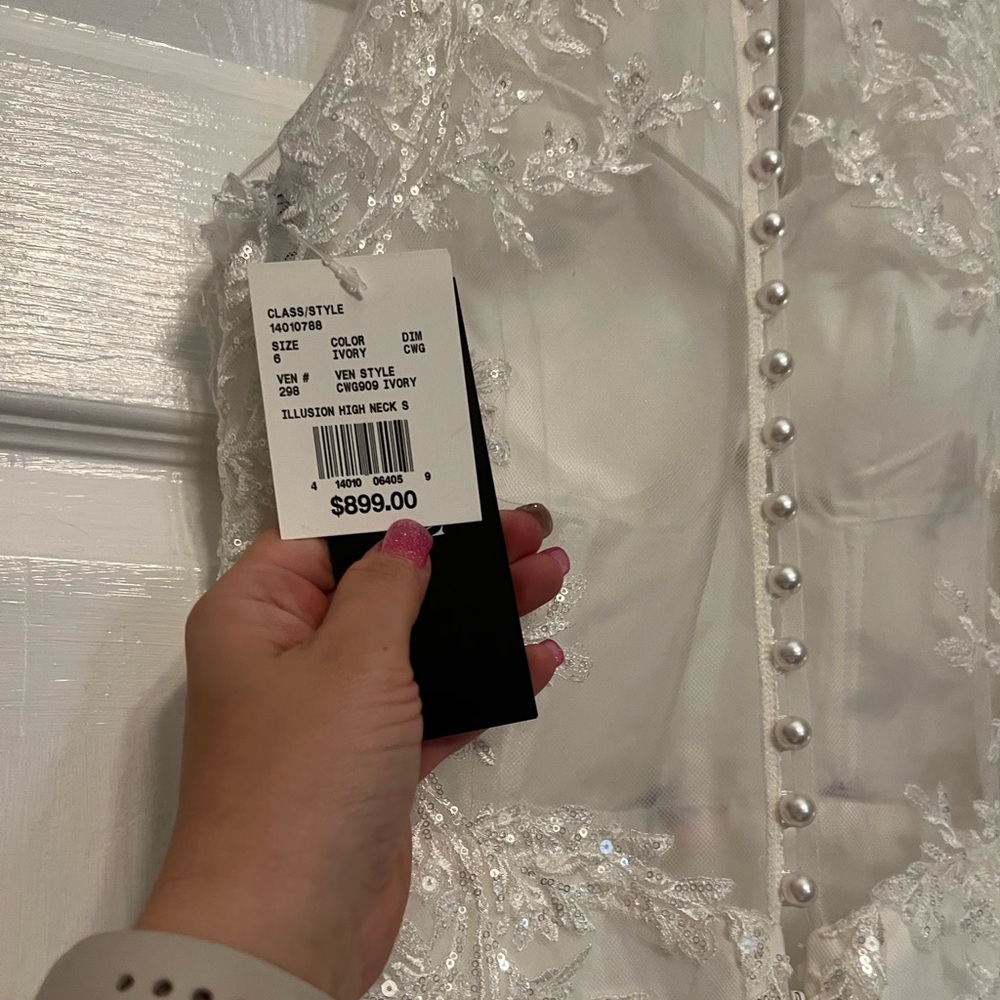 Wedding dress new with tags. Oleg Cassini designer